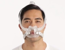 Man wearing ResMed full face CPAP mask